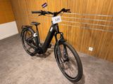 a bicycle that is parked next to a wooden wall