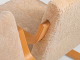 a chair that has a seat that is made out of a piece of fabric