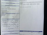 a picture of a receipt that has been placed on the seat of a car