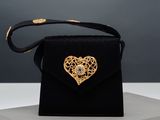 black velvet bag with gold heart broochet