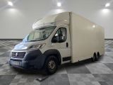 a picture of a white truck parked in a room