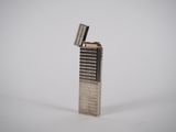 a close up of a lighter on a white surface