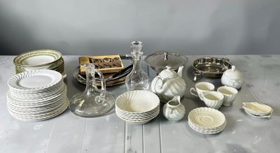 a table with a lot of dishes and cups on it