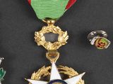 a lot of medals that are on a black table