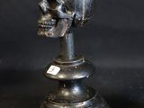 two skulls sitting on top of each other on a table