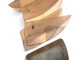 three pieces of wood and a knife on a white surface