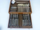 a wooden box with a set of silverware in it