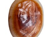 a picture of a carved stone with a man on it