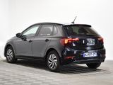the back end of a black car parked in a white room