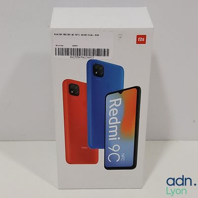 packaging of a redmik c phone in a box on a white surface