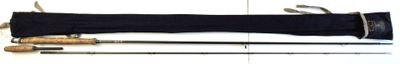 three different types of fishing rods on a white surface