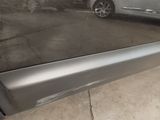 a picture of a car that is parked in a garage
