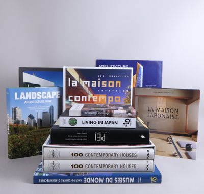 several books are stacked on top of each other on a table
