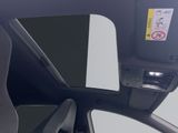 the interior of a car with a view of the sunroof
