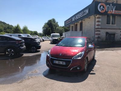 a red car that is parked in front of a building