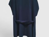 the back view of a chair with a dark blue cover on it