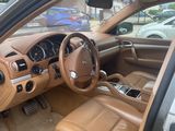 the interior of a car with a tan leather seat and dashboard