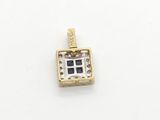 an image of a gold and silver pendant with squares on it