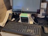 a desk with a keyboard, mouse, and monitor on it
