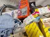 a pile of assorted items sitting on a bed