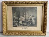 une vieille photo d'un groupe de personnes assises autour d'une table