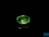 a green tourmaline gems on a black background