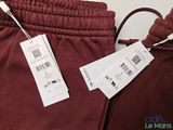 a pair of pants with tags on them on a table