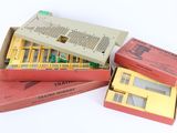 three boxes of electronic components are stacked on top of each other