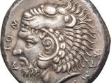 a silver coin with a head of a lion on it