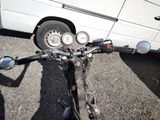 a motorcycle that is parked next to a van