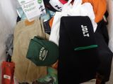 a pile of clothing and a hat in a box