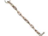 a close up of a silver chain with a cross on it