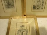two framed pictures of a building and a church in a gold frame