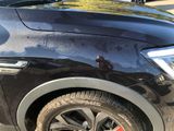 a close up of a black car with a bullet on it