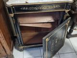 an old stove with a door open in a room