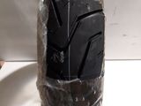 a pair of black shoes that are wrapped in plastic