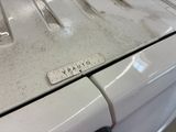 a close up of a dirty washer and dryer
