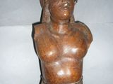 wooden bust of a man with a turban on his head