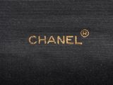 chanel logo on the side of a black bag