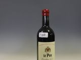 a bottle of wine that is sitting on a counter