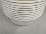 a lot of white bowls stacked on top of each other