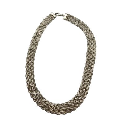 a close up of a necklace on a white background