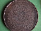 an image of a metal plate with a design on it