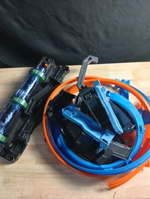 a bowl of assorted wires and wires on a wooden table