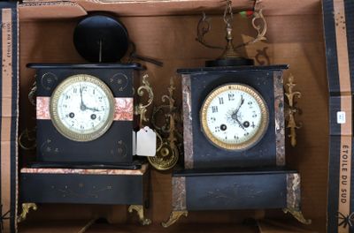 two clocks that are sitting in a box together