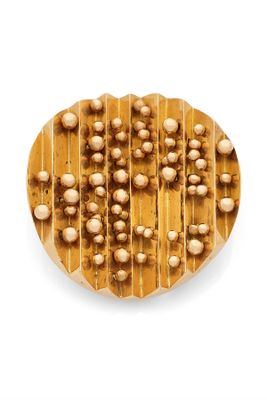 an overhead view of a cookie with nuts on it on a white background