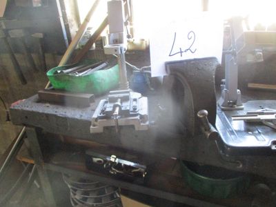 a machine that is sitting on top of a workbench