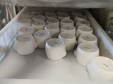 many cups that are in the bottom of the refrigerator