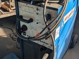 a welding machine that is sitting on the ground
