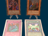 three cards are on display on a table with a blue background
